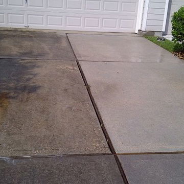 A driveway being power washed