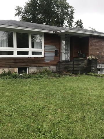 freshly painted black house with white accents