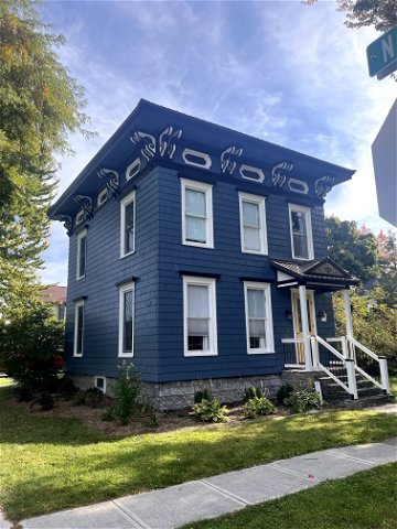 vertical image of blue painted house