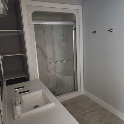 a white bathroom with a fresh coat of paint