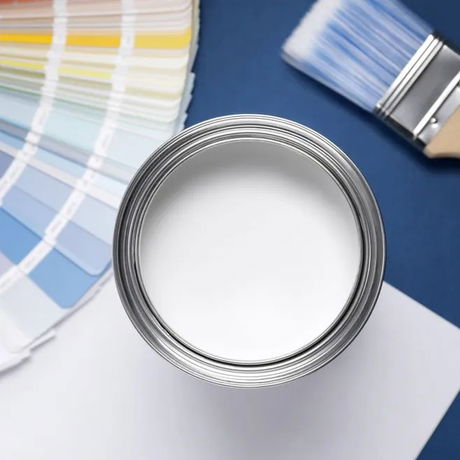 A paint bucket, brush and colour palette