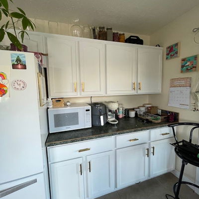 a brand new white bathroom with wood flooring