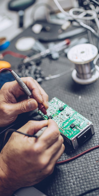 Person soldering a PCB