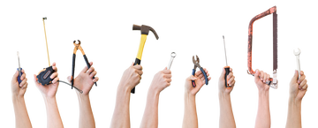 a variety of hands holding tools facing upwards